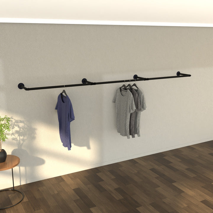 WallWear wall-mounted clothes rail, offering a clean and modern display for garments.